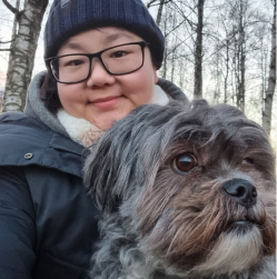 Face of a woman called Su Ann and a small furry dog called Chewie